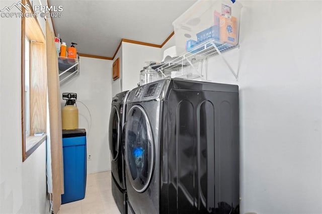 10635 Via Vaquaro Pt, Fountain, CO 80817 - laundry room featuring separate washer and dryer and crown molding