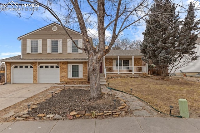 6424 Rifle Cir, Colorado Springs, CO 80919 - view of front of home with concrete driveway, brick siding, covered porch, and a garage
