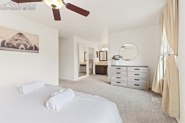6424 Rifle Cir, Colorado Springs, CO 80919 - bedroom with light carpet, connected bathroom, and ceiling fan