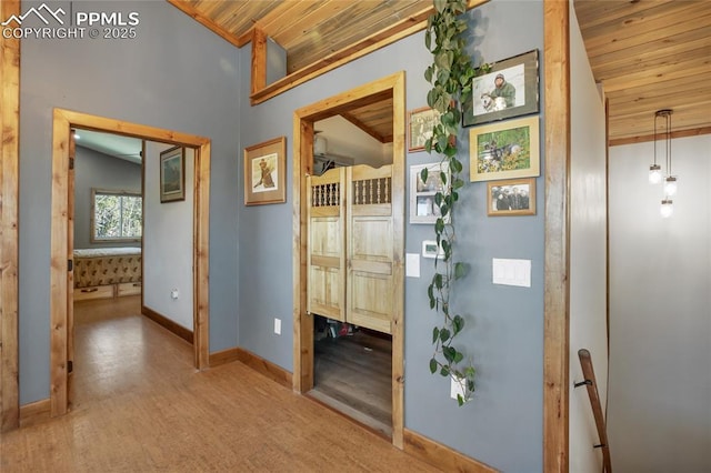 2747 County Road 61, Cripple Creek, CO 80813 - hall with wood ceiling, lofted ceiling, wood finished floors, and baseboards