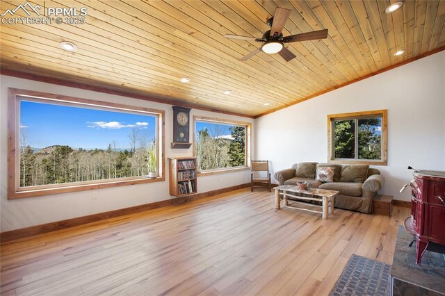 2747 County Road 61, Cripple Creek, CO 80813 - living area with wooden ceiling, vaulted ceiling, ceiling fan, wood finished floors, and baseboards