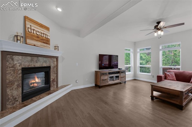 living area featuring wood finished floors, baseboards, a ceiling fan, a high end fireplace, and recessed lighting