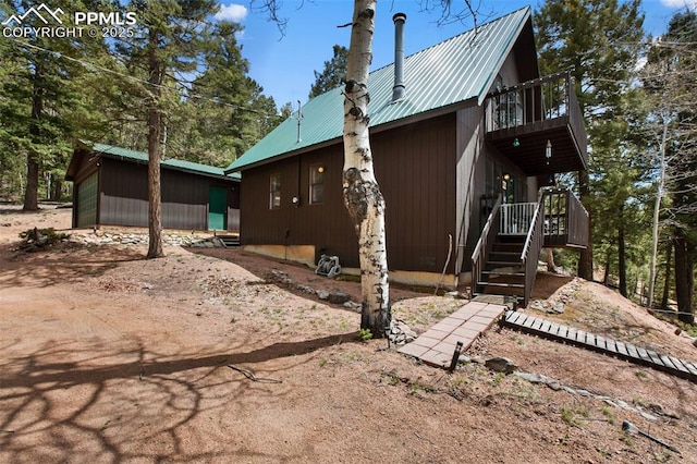 826 Troy Dr, Cripple Creek, CO 80813 - view of home's exterior featuring a balcony and metal roof