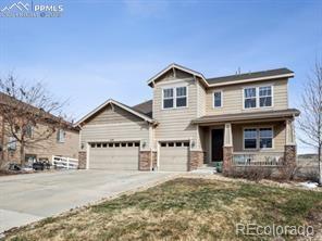3197 Cool Meadow Pl, Castle Rock, CO 80104 - craftsman inspired home featuring covered porch, concrete driveway, and an attached garage