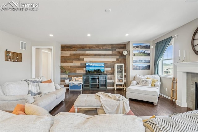 3197 Cool Meadow Pl, Castle Rock, CO 80104 - living area with a brick fireplace, recessed lighting, wood finished floors, baseboards, and wooden walls