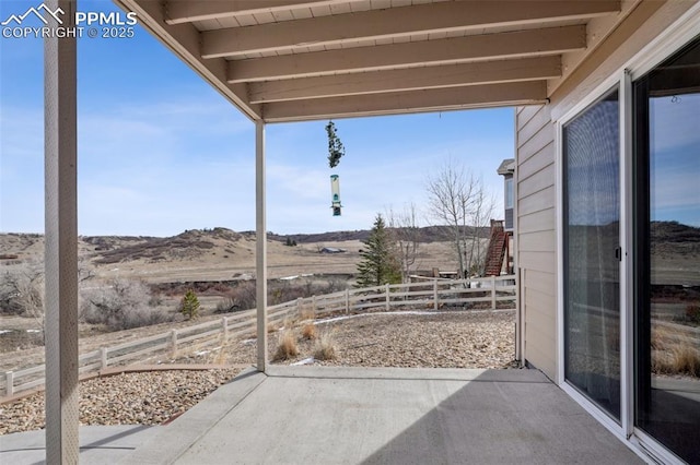 3197 Cool Meadow Pl, Castle Rock, CO 80104 - view of patio featuring fence and a mountain view