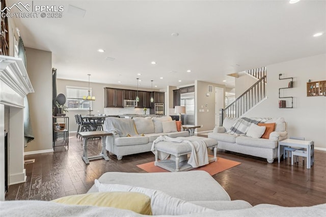 3197 Cool Meadow Pl, Castle Rock, CO 80104 - living room featuring dark wood-style flooring, stairway, baseboards, and recessed lighting