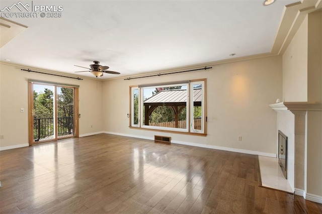 1303 Hermosa Way, Colorado Springs, CO 80906 - unfurnished living room featuring healthy amount of natural light, ceiling fan, wood finished floors, baseboards, and recessed lighting