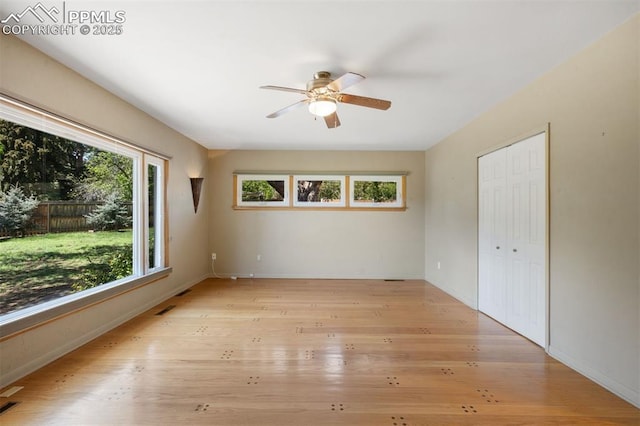 1303 Hermosa Way, Colorado Springs, CO 80906 - empty room with ceiling fan, light wood finished floors, and baseboards