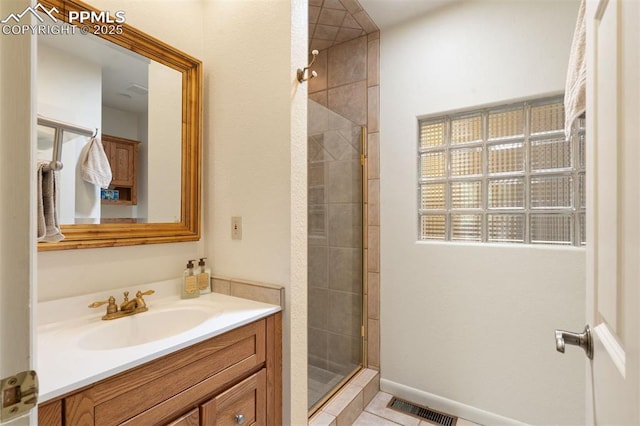 1303 Hermosa Way, Colorado Springs, CO 80906 - full bathroom with vanity, a shower stall, and tile patterned floors