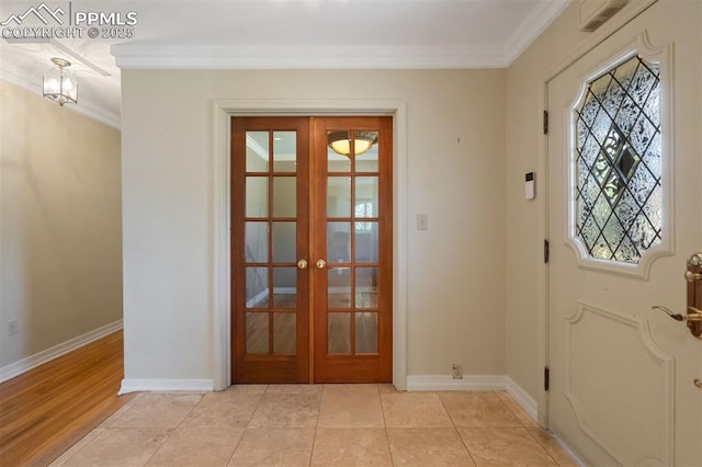 1303 Hermosa Way, Colorado Springs, CO 80906 - foyer entrance featuring ornamental molding, french doors, and baseboards