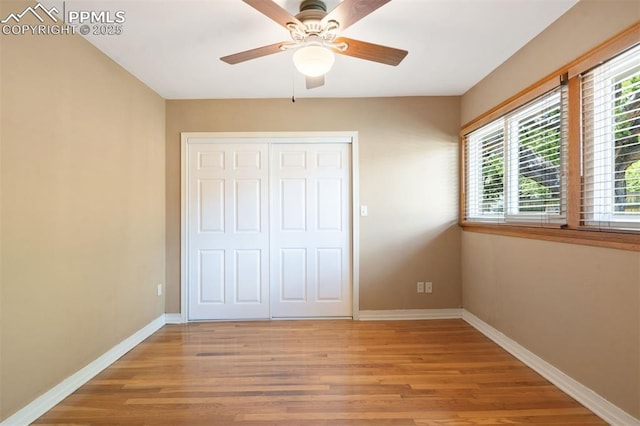 1303 Hermosa Way, Colorado Springs, CO 80906 - unfurnished bedroom featuring light wood-style flooring, baseboards, a closet, and ceiling fan