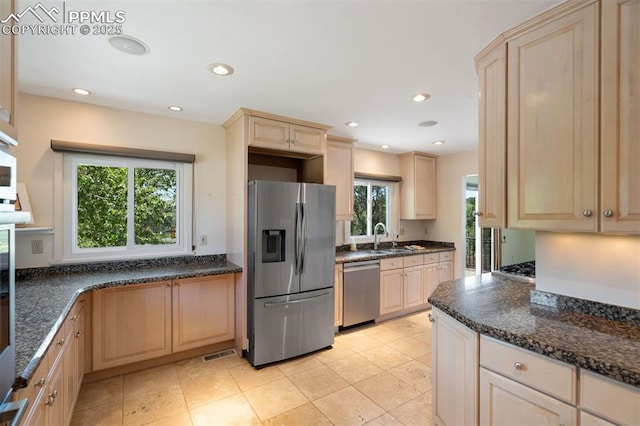 1303 Hermosa Way, Colorado Springs, CO 80906 - kitchen featuring appliances with stainless steel finishes, light brown cabinetry, a sink, recessed lighting, and light tile patterned floors