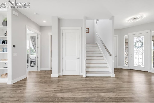 19887 Kershaw Ct, Monument, CO 80132 - foyer entrance with stairs, wood finished floors, recessed lighting, and baseboards