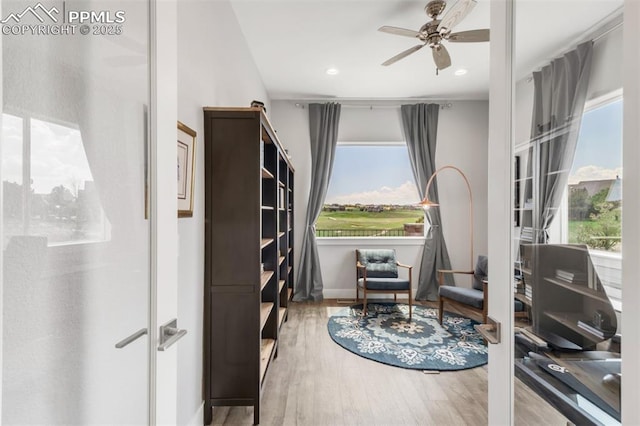 19887 Kershaw Ct, Monument, CO 80132 - living area with ceiling fan, healthy amount of natural light, wood finished floors, baseboards, and recessed lighting