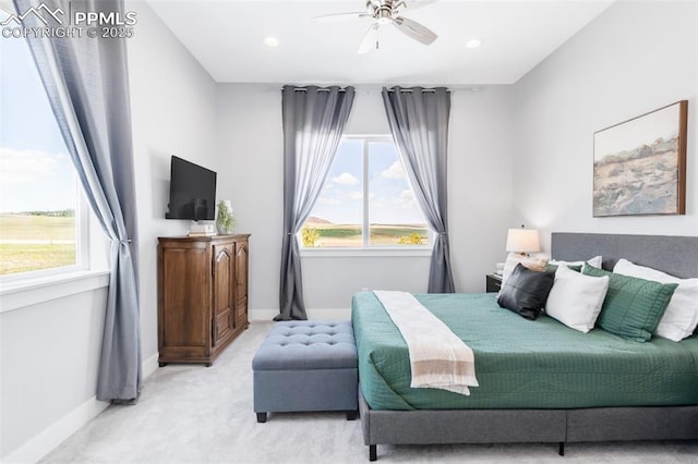 19887 Kershaw Ct, Monument, CO 80132 - bedroom featuring multiple windows, light colored carpet, baseboards, a ceiling fan, and recessed lighting