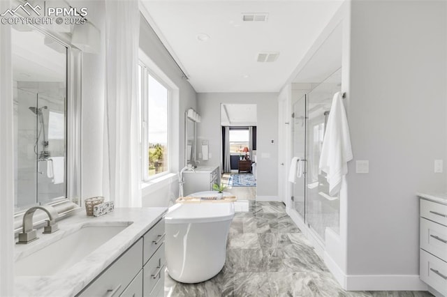 19887 Kershaw Ct, Monument, CO 80132 - bathroom with two vanities, a stall shower, and a freestanding tub