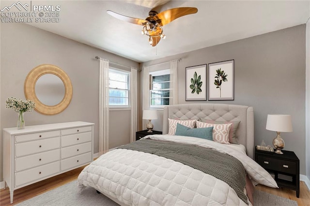 717 W Monroe St, Colorado Springs, CO 80907 - bedroom featuring wood finished floors, ceiling fan, and baseboards