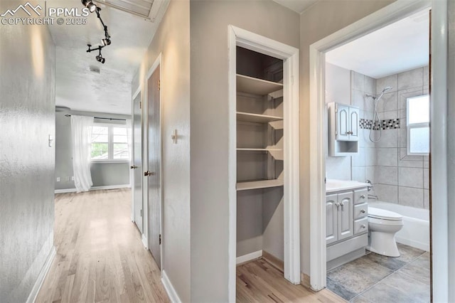 717 W Monroe St, Colorado Springs, CO 80907 - hall with light wood-style flooring and baseboards