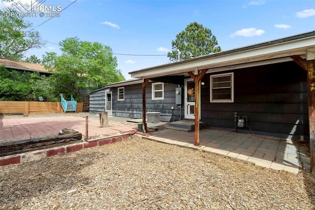 717 W Monroe St, Colorado Springs, CO 80907 - back of house featuring fence, a patio, and central AC unit