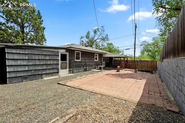 717 W Monroe St, Colorado Springs, CO 80907 - back of house with a fenced backyard and a patio area