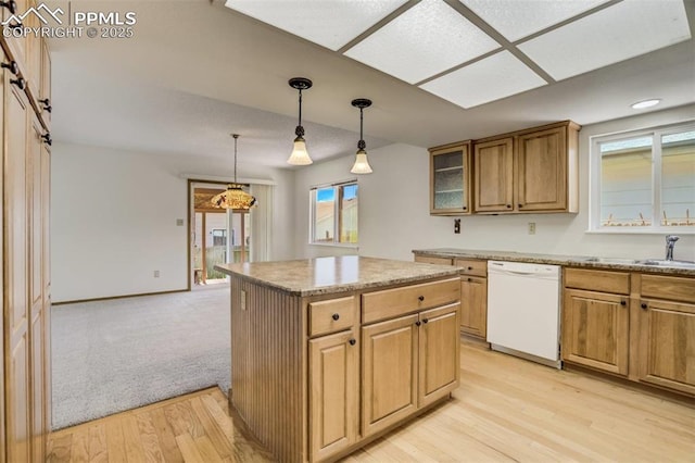 1559 Sausalito Dr, Colorado Springs, CO 80907 - kitchen featuring white dishwasher, light wood-style flooring, healthy amount of natural light, and decorative light fixtures