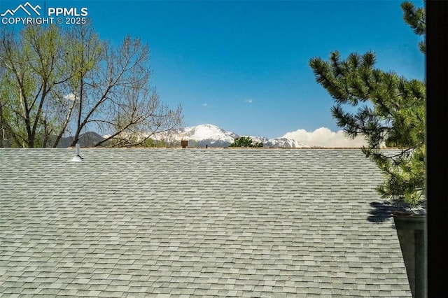1559 Sausalito Dr, Colorado Springs, CO 80907 - exterior view of roof with shingles and a mountain backdrop