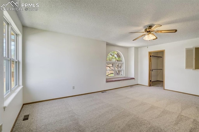 1559 Sausalito Dr, Colorado Springs, CO 80907 - unfurnished bedroom featuring carpet, a textured ceiling, baseboards, and ceiling fan