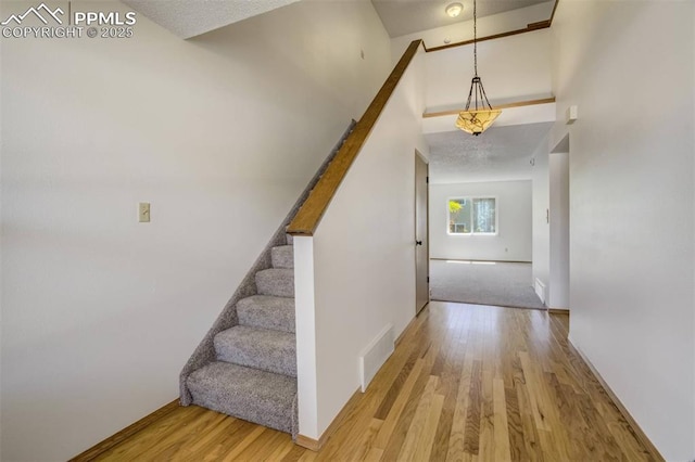 1559 Sausalito Dr, Colorado Springs, CO 80907 - stairs with wood finished floors and baseboards