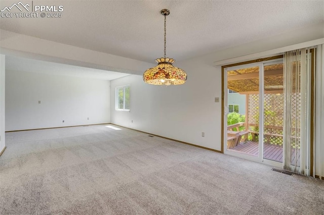 1559 Sausalito Dr, Colorado Springs, CO 80907 - carpeted empty room with a textured ceiling and baseboards