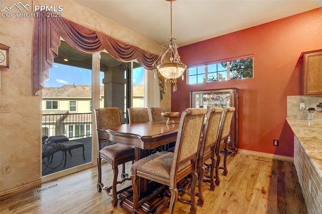 8396 Snow Cap Vw, Colorado Springs, CO 80920 - dining space with light wood-style floors and baseboards