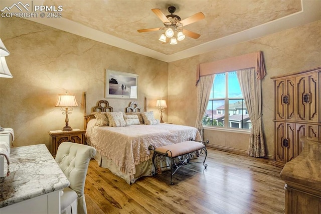 8396 Snow Cap Vw, Colorado Springs, CO 80920 - bedroom featuring light wood-style flooring, baseboards, and a ceiling fan