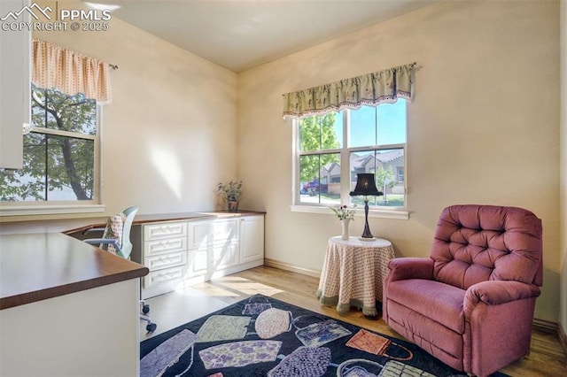 8396 Snow Cap Vw, Colorado Springs, CO 80920 - sitting room featuring wood finished floors and baseboards