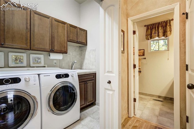 8396 Snow Cap Vw, Colorado Springs, CO 80920 - laundry room with cabinet space, washer and dryer, and baseboards