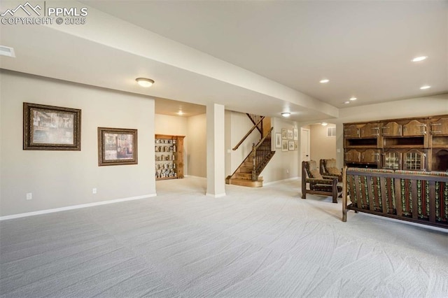 8396 Snow Cap Vw, Colorado Springs, CO 80920 - finished below grade area featuring baseboards, light carpet, stairs, and recessed lighting