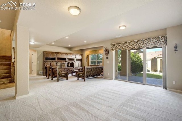 8396 Snow Cap Vw, Colorado Springs, CO 80920 - living area featuring light carpet, stairway, baseboards, and recessed lighting
