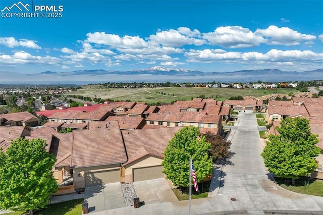 8396 Snow Cap Vw, Colorado Springs, CO 80920 - aerial perspective of suburban area with mountains