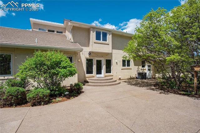 15635 Kingswood Dr, Colorado Springs, CO 80921 - rear view of house featuring stucco siding and a tiled roof