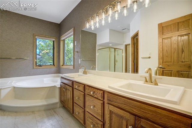 15635 Kingswood Dr, Colorado Springs, CO 80921 - full bathroom featuring a shower stall, a bath, double vanity, and marble finish flooring