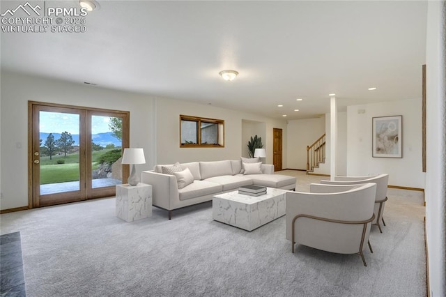 15635 Kingswood Dr, Colorado Springs, CO 80921 - living area featuring light carpet, stairs, and recessed lighting