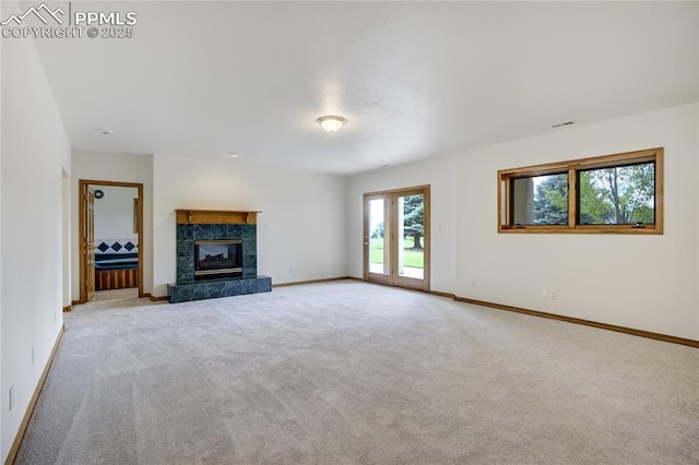 15635 Kingswood Dr, Colorado Springs, CO 80921 - unfurnished living room with carpet flooring and a tile fireplace