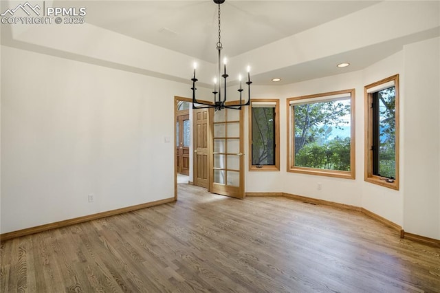 15635 Kingswood Dr, Colorado Springs, CO 80921 - unfurnished room with a chandelier, wood finished floors, and recessed lighting