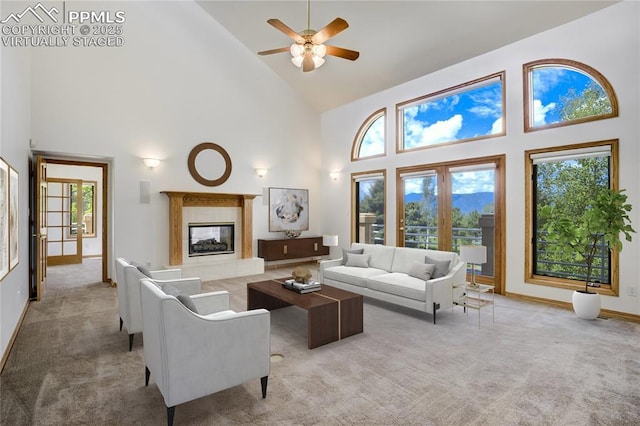 15635 Kingswood Dr, Colorado Springs, CO 80921 - living area featuring high vaulted ceiling, light colored carpet, a fireplace, and ceiling fan