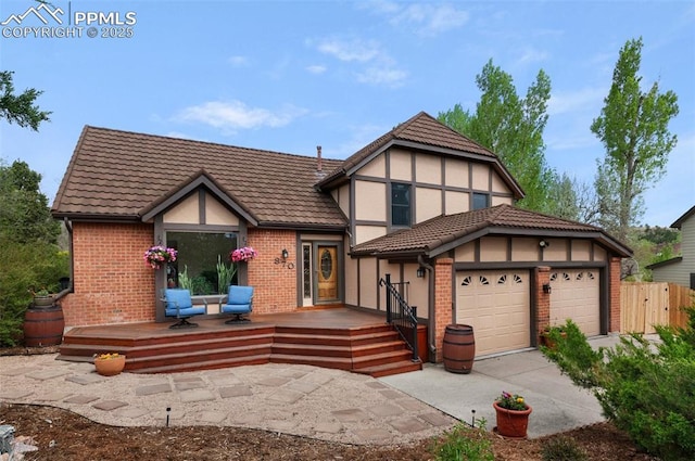 870 N Grey Eagle Cir, Colorado Springs, CO 80919 - tudor-style house featuring driveway, stucco siding, and brick siding
