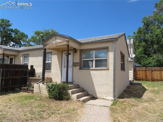 2354 E San Rafael St, Colorado Springs, CO 80909 - view of front of property featuring stucco siding and fence