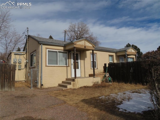 2354 E San Rafael St, Colorado Springs, CO 80909 - bungalow with stucco siding and fence