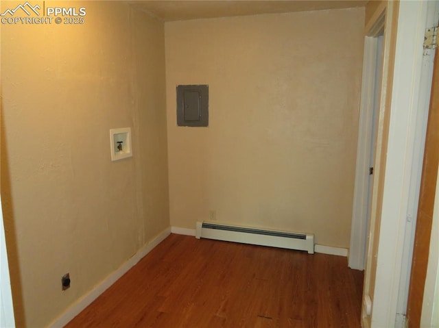 2354 E San Rafael St, Colorado Springs, CO 80909 - laundry area with a baseboard radiator, wood finished floors, hookup for a washing machine, electric panel, and baseboards