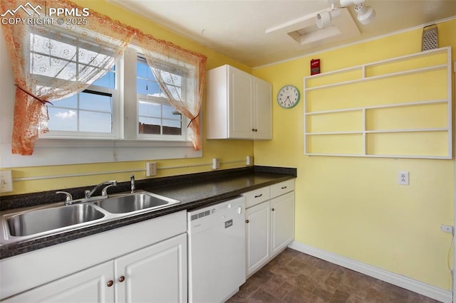 206 N 4th St, Victor, CO 80860 - kitchen with dishwasher, a sink, dark countertops, white cabinets, and baseboards