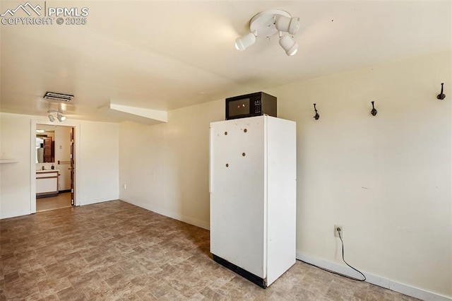 206 N 4th St, Victor, CO 80860 - spare room with baseboards and stone finish flooring