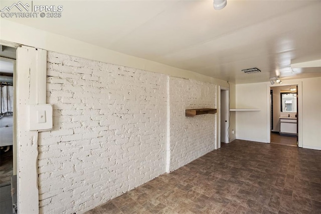 206 N 4th St, Victor, CO 80860 - unfurnished room featuring brick wall